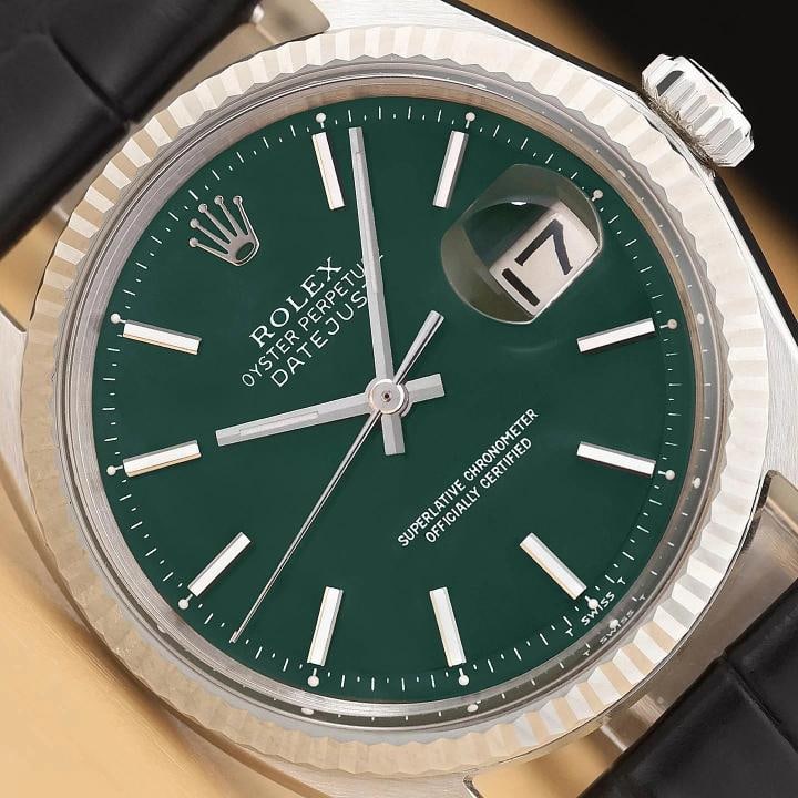 ROLEX DATEJUST 1601 GREEN DIAL 18K WHITE GOLD STEEL BLACK LEATHER BAND WATCH: This is an authentic Rolex Datejust 1601 watch with Rolex stick dial Ref., Rolex 18K white gold fluted bezel, and custom genuine black leather bracelet. Descriptions: Brand: Rolex Model: Datejust