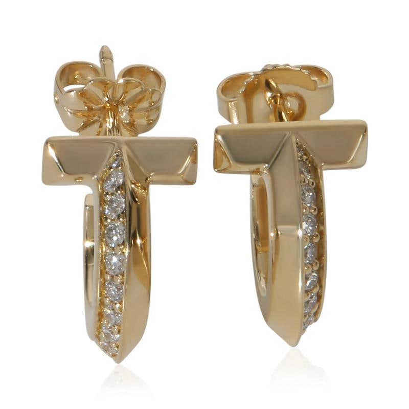 Tiffany & Co. Yellow Gold Diamond Tiffany T T1 Extra Small Hoop Earrings: Condition: Pre-owned,Shape: Round Brilliant,Item Length: 15 mm,Country of Origin: Italy,Side Stone Type: Diamond,Side Stone Weight (cts): 0.40,Metal Purity: 18k,With Original Box/Packaging: No,With