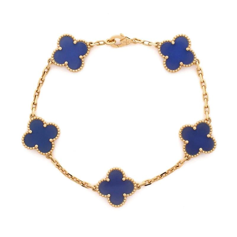 Van Cleef & Arpels Vintage Alhambra 5 Motifs Bracelet 18K Yellow Gold and Agate: Measurements: Circumference: 7.50 ", Width: 14.90 mm .Condition: Pre-owned - Good,Brand: Van Cleef & Arpels,Main Stone: Agate,Metal: 18K Yellow Gold,Metal Purity: 18K,Style: Bracelet,Type: