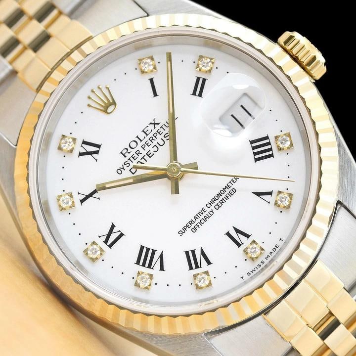 ROLEX MENS DATEJUST 16233 FACTORY ROMAN DIAMOND DIAL 18K YELLOW GOLD STEEL WATCH: This is an authentic Rolex Datejust 16233 watch with original Rolex 18K yellow gold and stainless steel jubilee bracelet, factory Rolex roman diamond dial, and Rolex 18K yellow gold fluted bezel.
