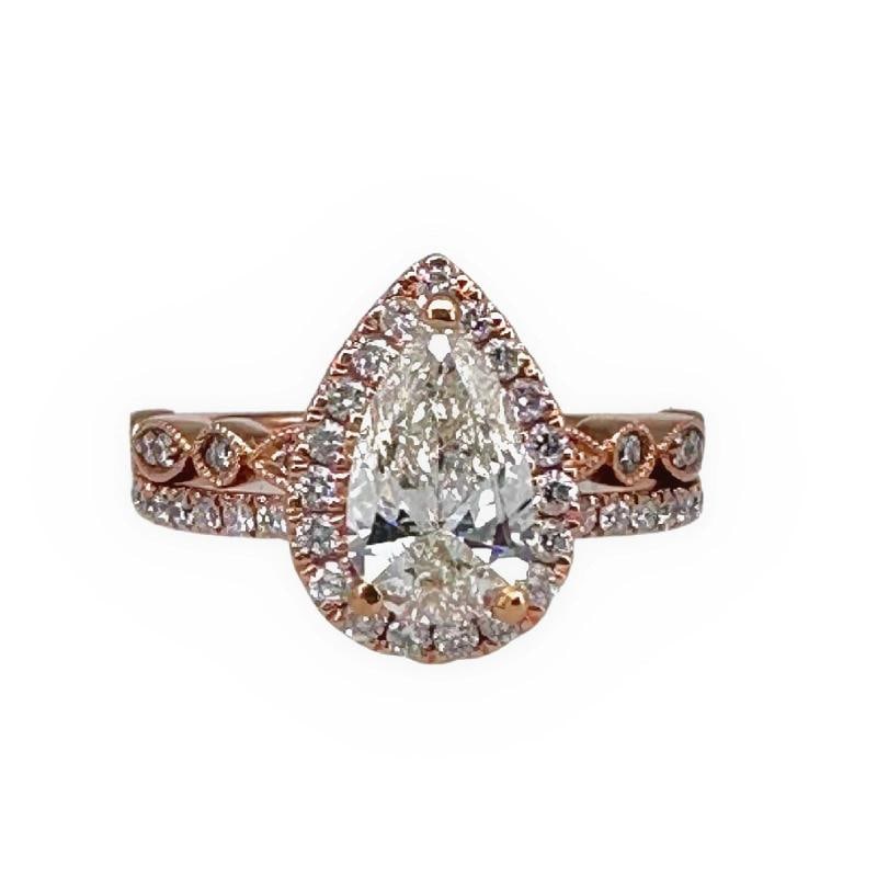 Robins Brothers Signature Pear Diamond 1.375 tcw 14K Rose Gold Engagement Ring: Condition: Pre-owned - Good,Number of Diamonds: 50,Main Stone Creation: Natural,Signed: Yes,Sizable: Yes,Main Stone Color: White/Colorless,Metal: Rose Gold,Total Carat Weight: 1.375