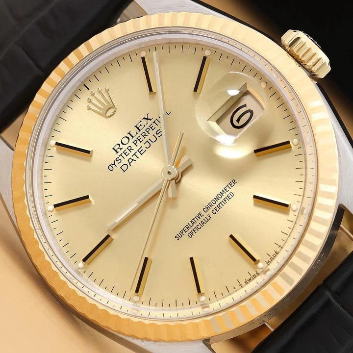 ROLEX MENS DATEJUST 16013 18K YELLOW GOLD STEEL CHAMPAGNE BLACK LEATHER WATCH: This is an authentic Rolex 16013 watch with Rolex stick dial, Rolex 18K yellow gold fluted bezel, and custom genuine black leather strap. Descriptions: Brand: Rolex Model: Datejust Reference: 16013 Ge