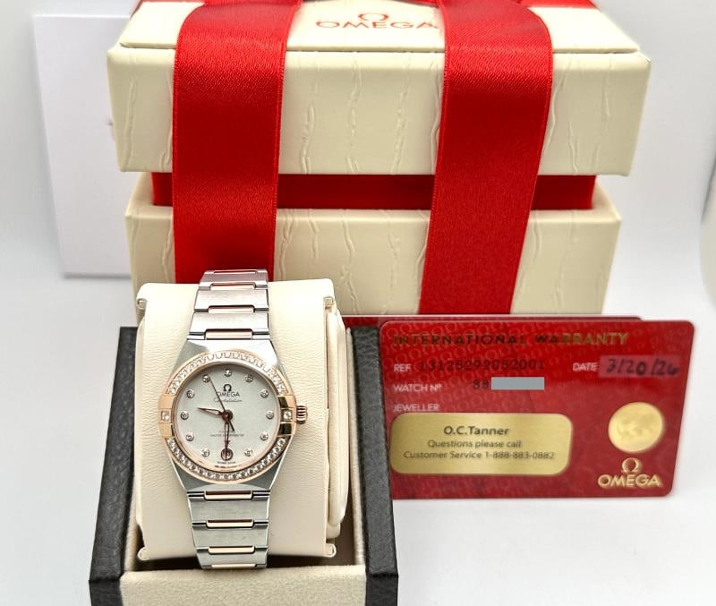 NEW 2026 Omega Constellation 131.25.29.20.52.001 Diamond Bezel 18K Gold Steel: Style Number: 131.25.29.20.52.001 Year: 2026 Model: Omega Constellation Case Material: Stainless Steel Band: 18K Sedna (Rose) Gold & Stainless Steel Bezel: Factory Diamond Bezel Dial: Factory Diamond