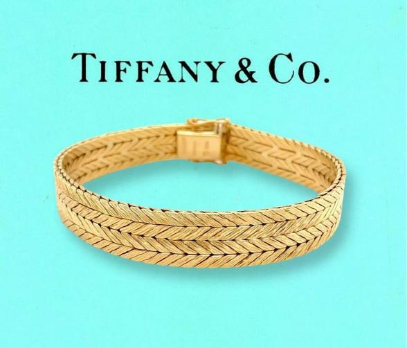 Tiffany & Co West Germany Double Row Herringbone Woven Bracelet 18kt Yellow Gold: Condition: Pre-owned - Good,Materials sourced from: Germany,Style: Cuff,Chain Type: Herringbone,Modified Item: No,Type: Bracelet,Item Length: 7.5 in,Metal Purity: 18k,Closure: Box,Main Stone: No