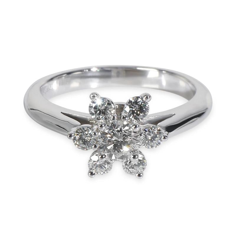 Tiffany & Co. Platinum Diamond Flower Ring: Condition: Pre-owned - Good,Shape: Round Brilliant,Country of Origin: Italy,With Original Box/Packaging: Yes,Side Stone Type: Diamond,Side Stone Weight (cts): 0.48,Metal Purity: 950,With Papers: