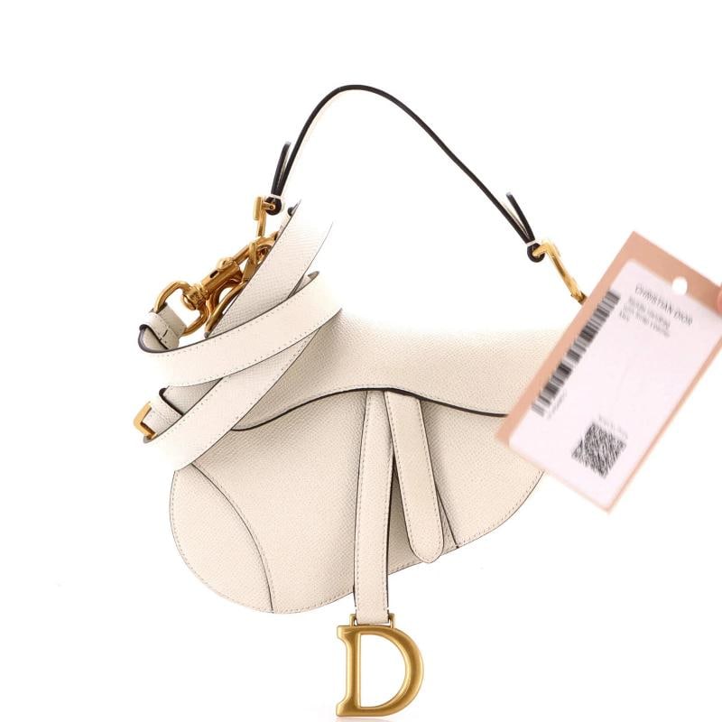Christian Dior Saddle Handbag with Strap Leather Mini: Condition: Pre-owned - Good,Brand: Christian Dior,Exterior Material: Leather,Style: Shoulder Bags,Exterior Color: White,Department: Women,Size: Mini,Accessories: With Strap Estimated Retail Price: