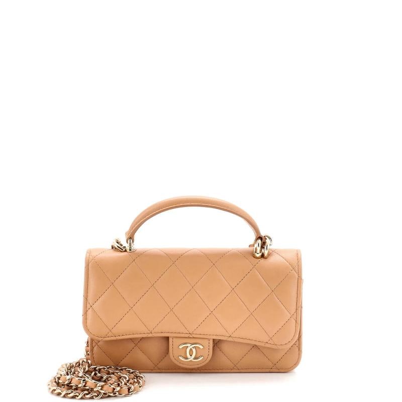 Chanel Classic Top Handle Flap Phone Holder with Chain Quilted Lambskin: Measurements: Height 4", Width 7", Depth 1.5" . Condition: Pre-owned - Excellent,Brand: Chanel,Exterior Material: Leather,Style: Cross Body Bags,Exterior Color: Neutral,Department: Women,Size:
