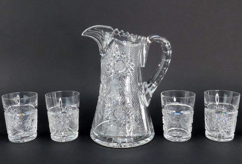 Dazzling American Brilliant Period Intaglio Cut Glass Water Pitcher w 4 Cups: The pitcher stands about 9 1/2 inches tall at the highest point, and measures about 7 3/4 inches from handle to spout, or about 5 1/2 inches across the body. The cups stand about 3 3/4 inches tall at