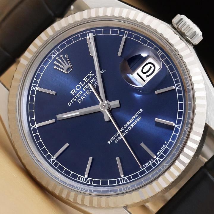 ROLEX MENS DATEJUST 16014 18K GOLD STEEL BLUE DIAL BLACK LEATHER BAND WATCH: This is an authentic Rolex Datejust 16014 watch with Rolex stick dial Ref., Rolex 18K white gold fluted bezel, and custom genuine black leather strap. Descriptions: Brand: Rolex Model: Datejust Refere