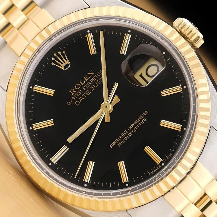 ROLEX MENS DATEJUST 16013 BLACK DIAL 18K YELLOW GOLD STAINLESS STEEL WATCH: This is an authentic Rolex Datejust 16013 watch with Rolex two tone 18K yellow gold and stainless steel jubilee bracelet, Rolex stick dial Ref., and Rolex 18K yellow gold fluted bezel. Descriptions: