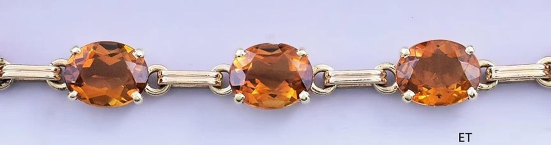 Stunning 14k Gold & ~24ct Honey Oval Citrine Bracelet: The bracelet will fit a wrist of about 6 1/2 inches in circumference or smaller. Due to the safety chain, it should go on easily even if the width of the wearer's hand is greater than the width of