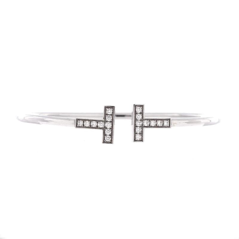 Tiffany & Co. T Wire Bracelet 18K White Gold with Diamonds: Measurements: Circumference: 6 ", Width: 2.45 mm . Condition: Pre-owned - Good,Brand: Tiffany & Co.,Main Stone: Diamond,Metal: 18K White Gold,Metal Purity: 18K,Style: Bracelet,Type: Bracelet,Color: Wh