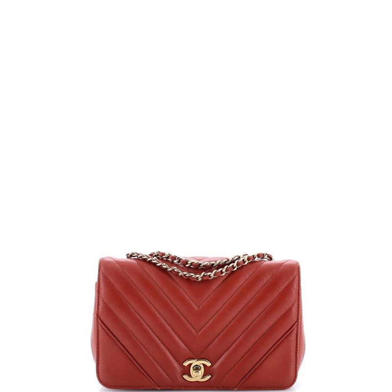 Chanel Statement Flap Bag Chevron Calfskin Mini: Accessories: Dust Bag Measurements: Handle Drop 10", Height 5", Width 8", Depth 3", Strap Drop 20". Accessories: Dust Bag Measurements: Handle Drop 10", Height 5", Width 8", Depth 3", Strap Drop 20". 