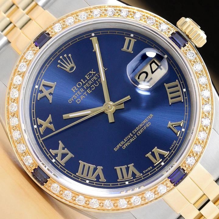 ROLEX MENS DATEJUST 16013 BLUE ROMAN DIAL SAPPHIRE DIAMOND 18K GOLD STEEL WATCH: This is an authentic Rolex Datejust 16013 watch with Rolex two tone 18K yellow gold and stainless steel jubilee bracelet, Rolex dial Ref. with added roman hour markers, and custom 18K yellow gold diam