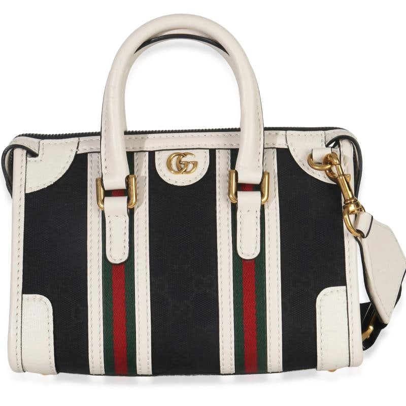 Gucci Black White Canvas Mini Double G Top Handle Bag: Condition: Pre-owned - Good,Country of Origin: Italy,Dimensions: 8.75 x 6 x 4,Handbag Accessories: Dustbag;Removable Straps,Bag Width: 8.75 in,Bag Depth: 4 in,Bag Height: 6 in,Department: Unisex,Style