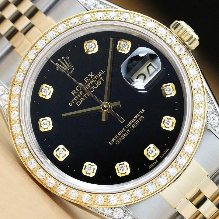 ROLEX MENS DATEJUST 16013 BLACK 18K GOLD STEEL DIAMOND BEZEL AND LUGS WATCH: This is an authentic Rolex Datejust 16013 watch with Rolex 18K yellow gold and stainless steel jubilee bracelet, Rolex dial Ref. with added diamond markers, custom 18K yellow gold diamond bezel, and a