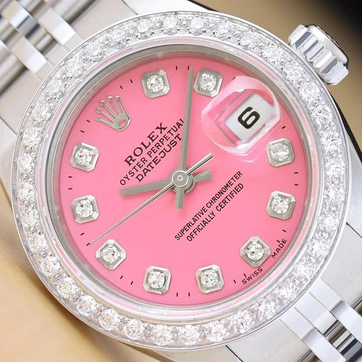 ROLEX LADIES DATEJUST 69174 PINK DIAMOND 18K WHITE GOLD STEEL JUBILEE WATCH: This is an authentic Rolex Datejust 69174 watch with Rolex stainless steel jubilee bracelet, Rolex dial Ref. with added diamond markers, and custom 18K white gold diamond bezel. Descriptions: Brand: R