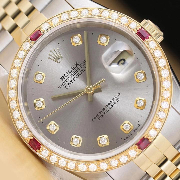 ROLEX MENS DATEJUST 16233 GRAY DIAL 18K GOLD STEEL TWO TONE DIAMOND RUBY WATCH: This is an authentic Rolex Datejust 16233 watch with two tone 18K yellow gold and stainless steel jubilee bracelet, Rolex dial Ref. with added genuine diamond markers, and custom 18K yellow gold diamo