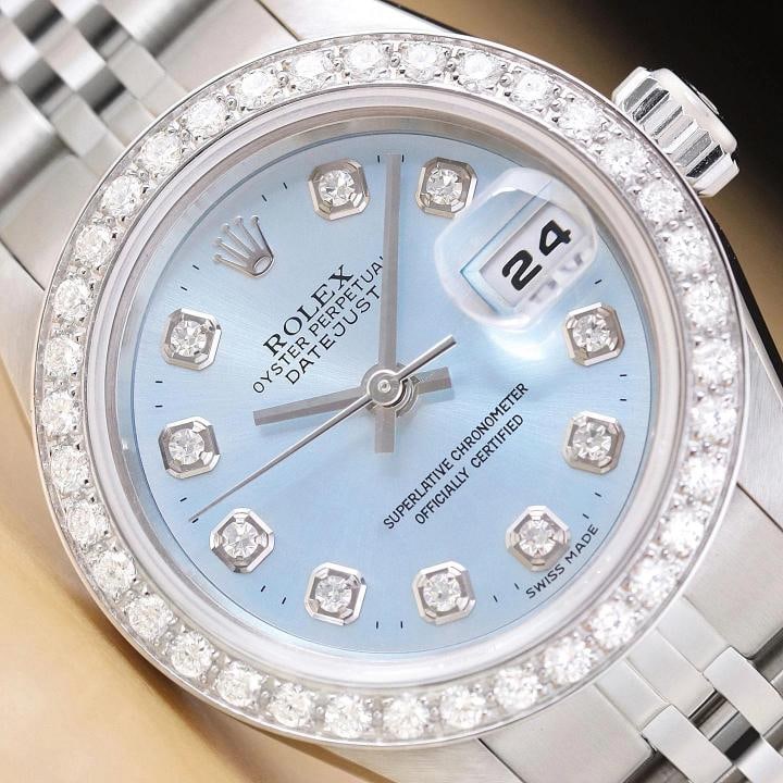 ROLEX LADIES DATEJUST 79174 NO HOLES ICE BLUE DIAL 18K GOLD STEEL DIAMOND WATCH: This is an authentic Rolex Datejust 79174 no holes watch with Rolex stainless steel jubilee bracelet, Rolex dial Ref. with added diamond markers, and custom 18K white gold diamond bezel. Descriptions: