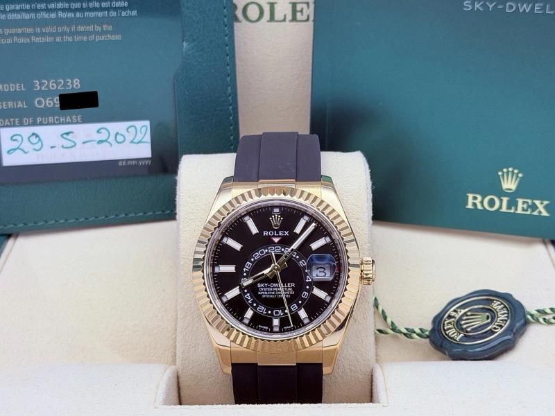 Rolex Sky Dweller 326238 42mm Black Dial 18K Yellow Gold Oysterflex Box Papers: Style Number: 326238 Year: 2022 Model: Rolex Sky Dweller Case Material: 18k Yellow Gold Band: Rolex Oysterflex Bezel: 18k Yellow Gold Fluted Dial: Black Crystal: Sapphire Case Size: 42mm Includes: - R