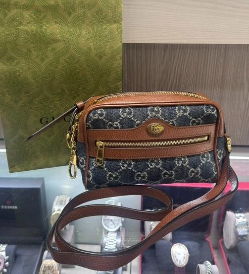 Gucci Denim GG Monogram Crossbody Bag (Style #517350): Condition: Pre-owned - Good,Brand: Gucci,Pattern: Monogram,Department: Women,Exterior Color: Blue,Style: Crossbody,Exterior Material: Denim,Country of Origin: Italy This pre-owned Gucci Denim GG Monog