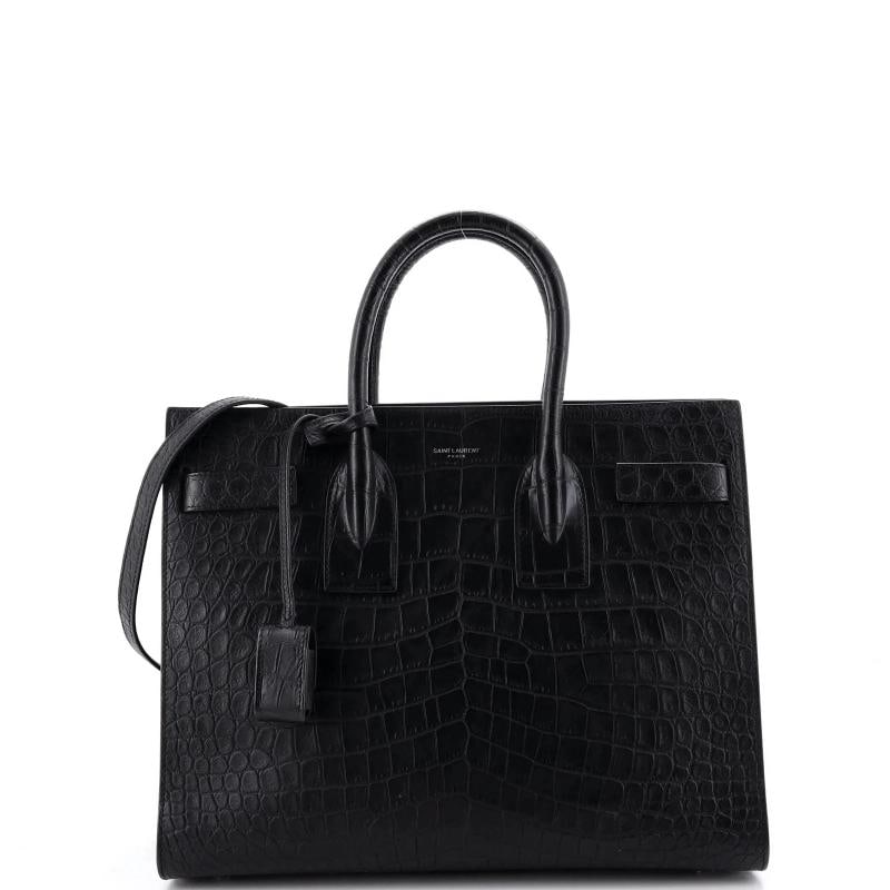 Saint Laurent Sac de Jour NM Bag Crocodile Embossed Leather Small: Accessories: Clochette, Keys, Lock, With Strap Measurements: Handle Drop 4.5", Height 10", Width 12.5", Depth 6.5", Strap Drop 19". Condition: Pre-owned - Good,Brand: Saint Laurent,Exterior Material: 