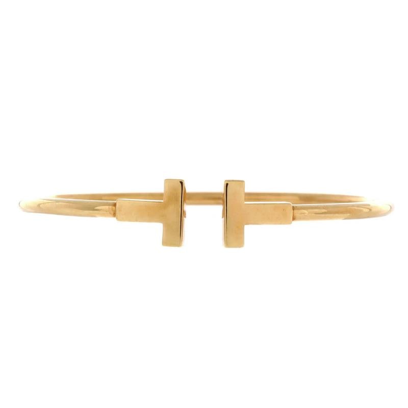 Tiffany & Co. T Wire Bracelet 18K Yellow Gold: Measurements: Circumference: 6.00 ", Width: 2.45 mm . Condition: Pre-owned - Good,Brand: Tiffany & Co.,Main Stone: Unknown,Metal: 18K Yellow Gold,Metal Purity: 18K,Style: Bracelet,Type: Bracelet,Color