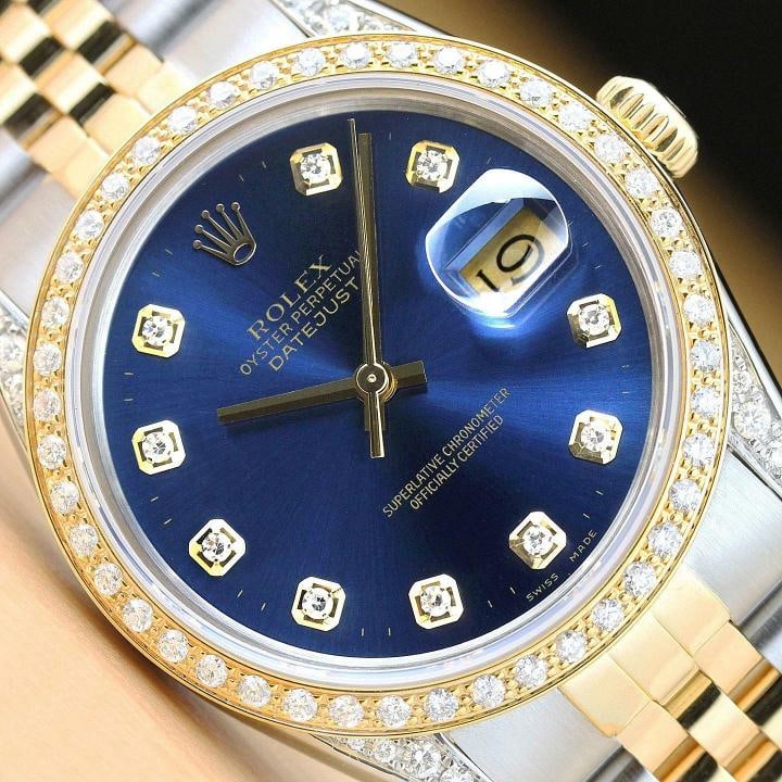 ROLEX MENS DATEJUST 16013 18K YELLOW GOLD DIAMOND STAINLESS STEEL BLUE WATCH: This is an authentic Rolex Datejust 16013 watch with Rolex 18K yellow gold and stainless steel jubilee bracelet, Rolex dial Ref. with added diamond markers, custom 18K yellow gold diamond bezel, and a