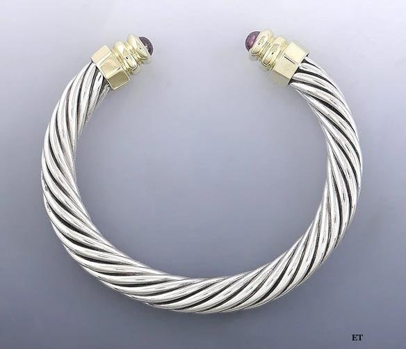 Sterling Silver 14k Gold Pink Tourmaline Cable Twist Torc Bangle Bracelet: The interior circumference of the bracelet is about 6 1/4 inches, so it will fit a wrist of 6 1/8 inches or less. The bracelet does have some flex to it and could probably be widened to fit a larger w