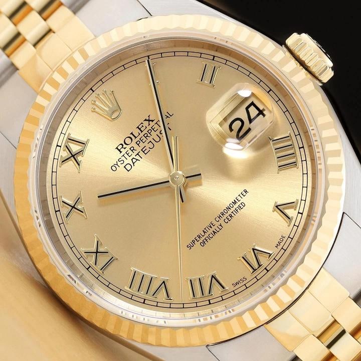 ROLEX MENS DATEJUST 16233 CHAMPAGNE ROMAN 18K GOLD STEEL NO HOLES TWO TONE WATCH: This is an authentic Rolex Datejust 16233 no holes watch with Rolex two tone 18K yellow gold and stainless steel jubilee bracelet, Rolex roman dial, and Rolex 18K yellow gold fluted bezel. Description