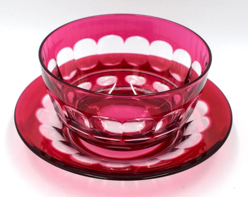Rare Set of 11 Val Saint Lambert Cranberry Cut to Clear Bowl & Underplates: This rare set of 11 Val Saint Lambert cranberry cut to clear bowl and underplates is a stunning addition to any table setting. Made of high-quality glass, the hand wash only care instructions ensure