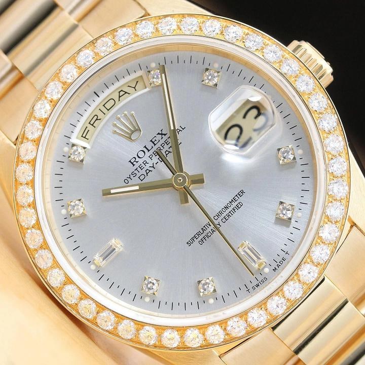 ROLEX MENS DAY DATE PRESIDENT 18238 FACTORY DIAL 18K GOLD WATCH + 1.60 CT BEZEL: This is an authentic Rolex Day-Date 18238 watch with Rolex 18K yellow gold president bracelet, factory Rolex diamond dial Ref., custom 18K yellow gold 1.60 CT diamond bezel, and factory Rolex box. Des