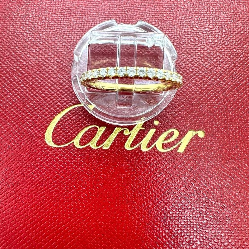 Cartier Etincelle De Cartier Diamond Eternity Wedding Band 18kt Yellow Gold: Condition: Pre-owned - Good,Number of Diamonds: 38,Main Stone Creation: Natural,Signed: Yes,Sizable: No,Metal: Yellow Gold,Materials sourced from: France,Total Carat Weight: 0.47 TCW,Main Stone: Diamo