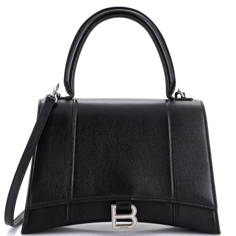 Balenciaga Hourglass Top Handle Bag Leather Medium: Accessories: Dust Bag, With Strap Measurements: Handle Drop 4.5", Height 7", Width 11", Depth 3.5", Strap Drop 8-22". Condition: Pre-owned - Good,Brand: Balenciaga,Exterior Material: Leather,Style:
