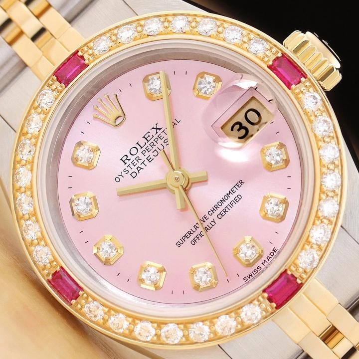 ROLEX LADIES DATEJUST 69173 PINK DIAL 18K YELLOW GOLD DIAMOND RUBY STEEL WATCH: Condition: Pre-owned - Excellent,Bezel Color: Gold,Max Wrist Size: 6.26-6.75 in,Number of Jewels: 29 Jewels,Indices: Diamond Markers, 12-Hour Dial,Band: Rolex Two Tone Jubilee Bracelet,Bezel: Custom 1