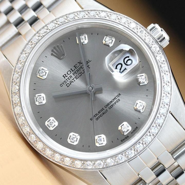 AUTHENTIC MENS ROLEX DATEJUST GRAY DIAMOND 18K WHITE GOLD STAINLESS STEEL WATCH: This is an authentic Rolex Datejust 16014 watch with Rolex stainless steel jubilee bracelet, Rolex dial Ref. with added custom diamond markers, and custom 18K white gold diamond bezel. Descriptions: