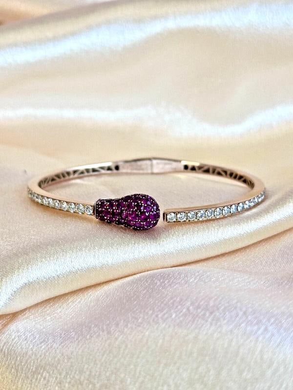 Vintage Ruby & Diamond Jacob & Co Match Cuff Bracelet In 18K Rose Gold: Condition: Pre-owned - Good,Number of Diamonds: 39,Main Stone Creation: Natural,Signed: Yes,Metal: Rose Gold,Total Carat Weight: 1.5CTW,Secondary Stone: Ruby,Main Stone: Diamond,Brand: Jacob & Co,Type