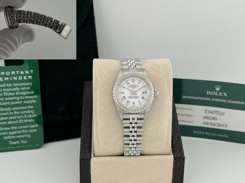 Rolex Oyster Perpetual Lady Date 69240 26mm White Roman Dial Steel Service Paper: Condition: Pre-owned - Excellent,Bezel Color: Silver,Movement: Mechanical (Automatic),,Indices: Roman Numerals,Year Manufactured: 1990-1999,Band/Strap: Rolex Jubilee,Reference Number: 69240,With Servi