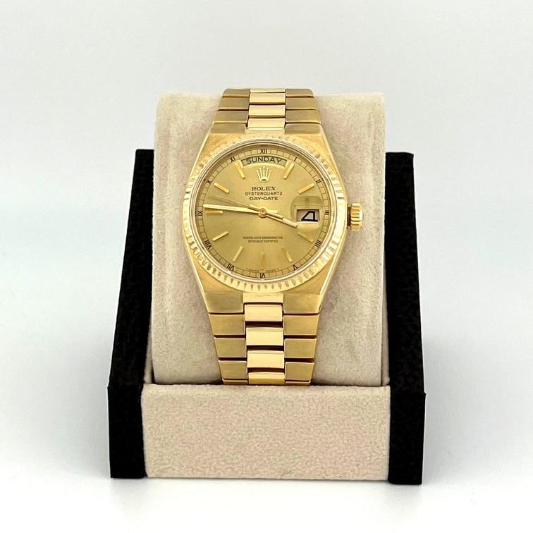 Rolex Day Date Oysterquartz 19018 36mm Champagne Dial 18K Yellow Gold: Condition: Pre-owned - Good,Bezel Color: Gold, Yellow,Indices: Stick Indexes,Year Manufactured: 1970-1979,Band/Strap: Bracelet,Case Color: Gold, Yellow,Department: Men,Bezel Type: Fluted,Watch Shape: 