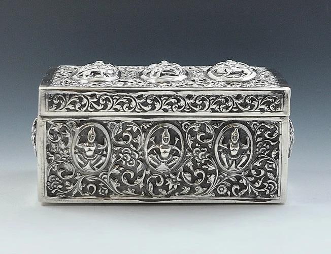 Fabulous 1800s South Asian Silver Tropical Wood-Lined Box: Country of Origin: India Presented is a fabulous antique South Asian silver box lined with a fragrant tropical wood. This old piece is beautifully hand chased with ornate floral swirls. The recessed p