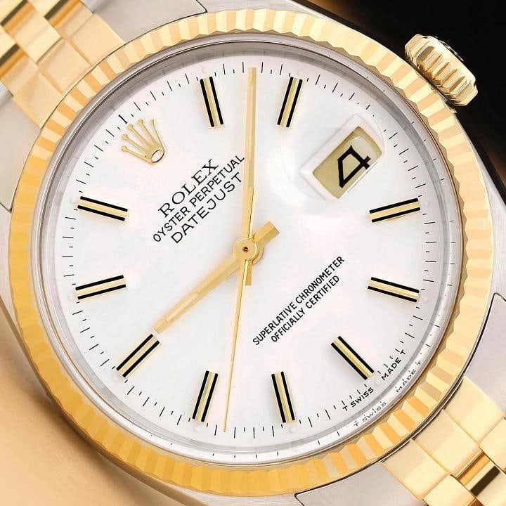 ROLEX MENS DATEJUST 16013 WHITE DIAL 18K YELLOW GOLD STAINLESS STEEL WATCH: This is an authentic Rolex Datejust 16013 watch with an original Rolex two tone 18K yellow gold and stainless steel jubilee bracelet, Rolex stick dial Ref., and Rolex 18K yellow gold fluted bezel.
