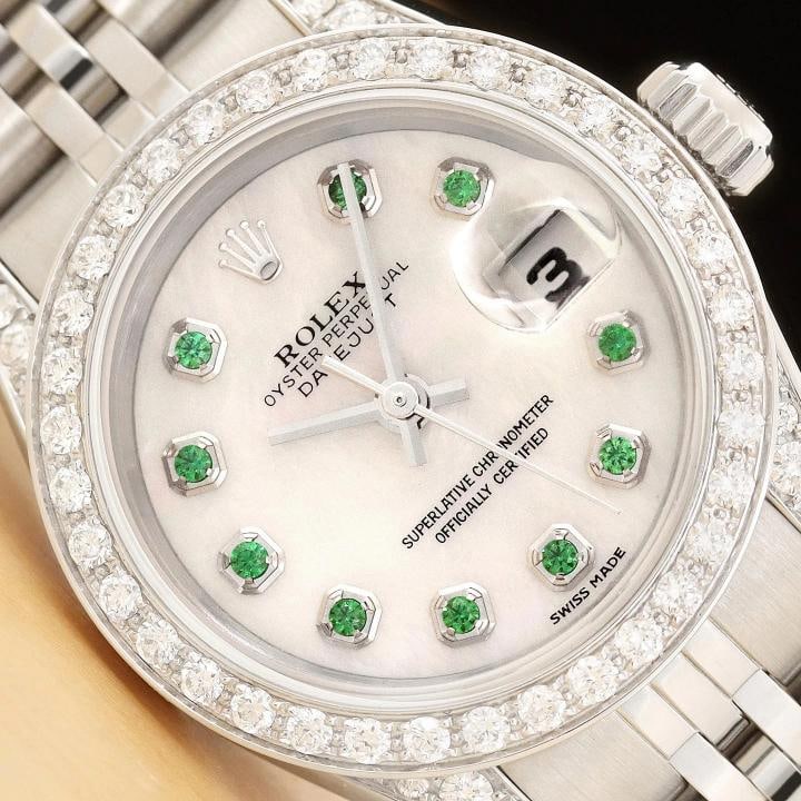 ROLEX DATEJUST 69174 MOTHER OF PEARL TSAVORITE DIAMOND 18K GOLD STEEL WATCH: This is an authentic Rolex Datejust 69174 watch with Rolex stainless steel jubilee bracelet, Rolex dial Ref. with added mother of pearl and tsavorite markers, custom 18K white gold diamond bezel, and 