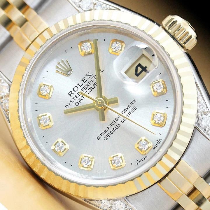 ROLEX LADIES DATEJUST SILVER DIAL 18K GOLD STEEL DIAMOND LUGS QUICKSET WATCH: This is an authentic Rolex Datejust 69173 watch with Rolex 18K yellow gold and stainless steel jubilee bracelet, Rolex dial Ref. with added genuine diamond markers, Rolex 18K yellow gold fluted bezel,