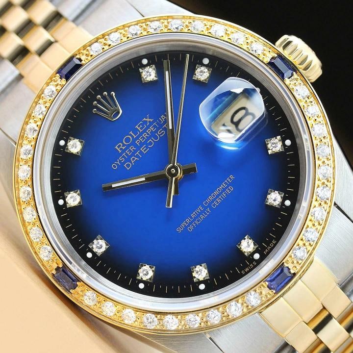 ROLEX MENS DATEJUST 16013 FACTORY DIAMOND DIAL 18K GOLD DIAMOND SAPPHIRE WATCH: This is an authentic Rolex Datejust 16013 watch with two tone 18K yellow gold and stainless steel jubilee bracelet, factory Rolex diamond dial Ref., and custom 18k yellow gold sapphire diamond bezel.
