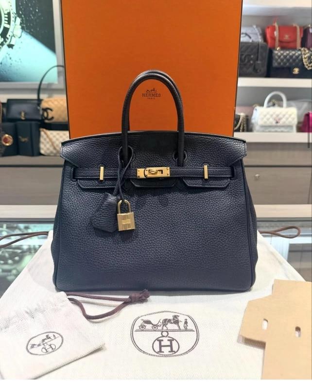 Hermes Birkin 25 Black Togo Leather with Gold Hardware (T Stamp, 2015): Condition: Pre-owned - Good,Bag Width: 10 in,Shape: Rectangle,Closure: Turn Lock,Handle/Strap Color: Black,Occasion: Business, Casual, Formal, Party/Cocktail, Travel,Hardware Color: Gold,Bag Depth: 5.