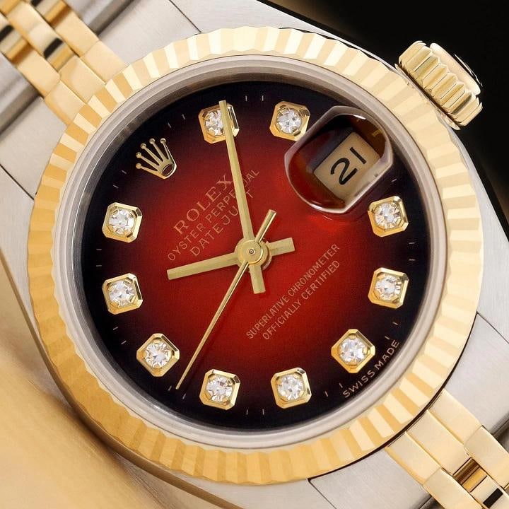 ROLEX DATEJUST 69173 RED VIGNETTE FACTORY DIAMOND 18K GOLD STEEL NO HOLES WATCH: This is an authentic Rolex 69173 watch with Rolex 18K yellow gold and stainless steel jubilee bracelet, factory Rolex diamond dial, and Rolex 18K yellow gold fluted bezel.. Descriptions: Brand: Rolex
