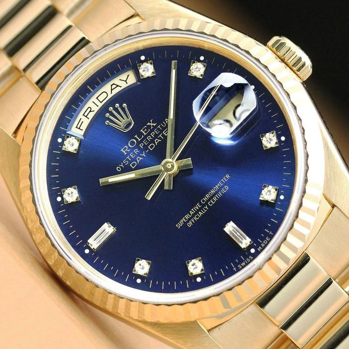 ROLEX MENS DAY DATE 18238 PRESIDENT 18K YELLOW GOLD BLUE FACTORY DIAMOND WATCH: This is an authentic Rolex Day-Date 18238 watch with Rolex 18K yellow gold president bracelet, factory Rolex diamond dial Ref., Rolex 18K yellow gold fluted bezel, and factory Rolex box. Descriptions: