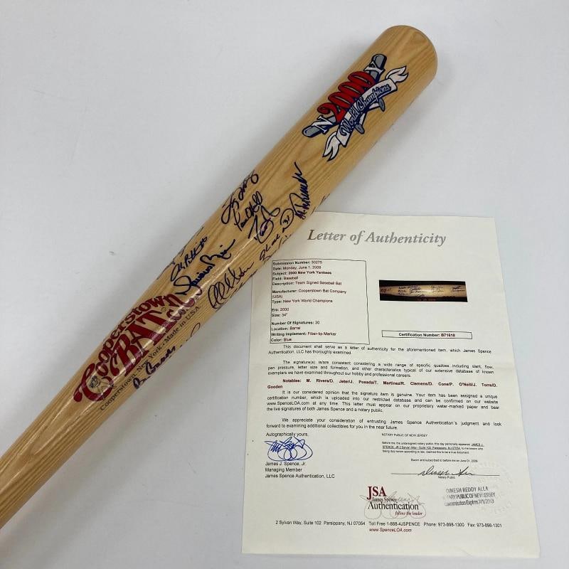 2000 NY Yankees WS Champs Team Signed Bat Derek Jeter Mariano Rivera JSA COA: signed in blue Sharpie by 30 members of the 2000 New York Yankees World Championship team. Notable signatures include Torre (Mgr.), Derek Jeter, Clemens, Cone, Pettitte, O'Neill, Rivera, Gooden,