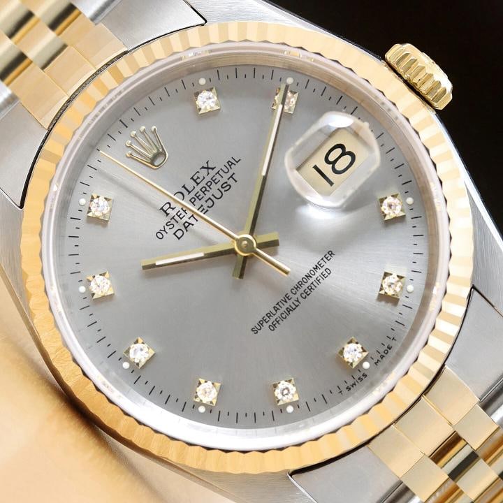 ROLEX MENS DATEJUST 16233 FACTORY DIAMOND 18K YELLOW GOLD STAINLESS STEEL WATCH: This is an authentic Rolex Datejust 16233 watch with Rolex two tone 18K yellow gold and stainless steel jubilee bracelet, factory Rolex diamond dial Ref., and Rolex 18K yellow gold fluted bezel.