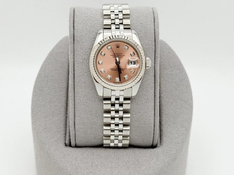 Rolex Ladies Datejust 179174 Pink Salmon Diamond Dial 18k Gold Steel Jubilee: Style Number: 179174 Serial: M82**** Year: 2008 Model: Rolex Ladies Datejust Case Material: Stainless Steel Band: Stainless Steel Jubilee Bezel: 18k White Gold Fluted Bezel Dial: Factory Salmon Diamon